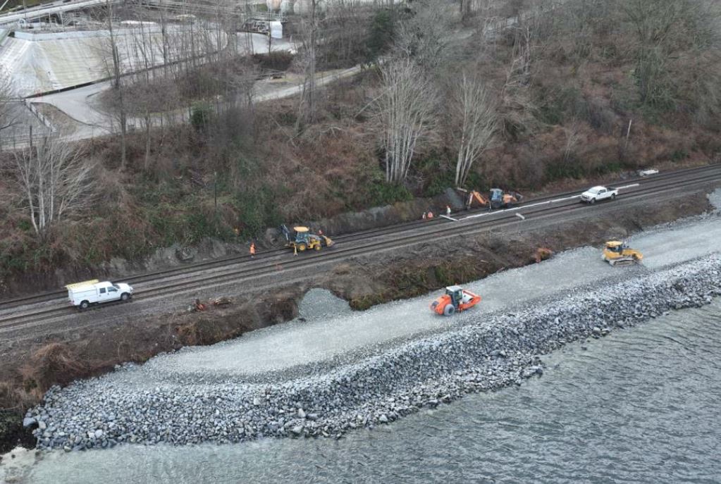Riprap shoreline embankment construction along the rail line at the water's edge